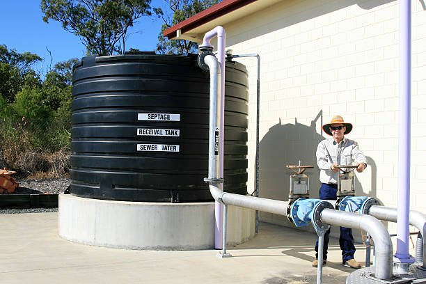 Sewage tank and Plant Worker at a sewage treatment plant. Click to see more...